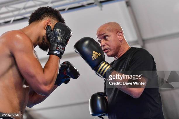 French heavyweight boxer Tony Yoka and his trainer Virgil Hunter at INSEP on December 12, 2017 in Vincennes, France.