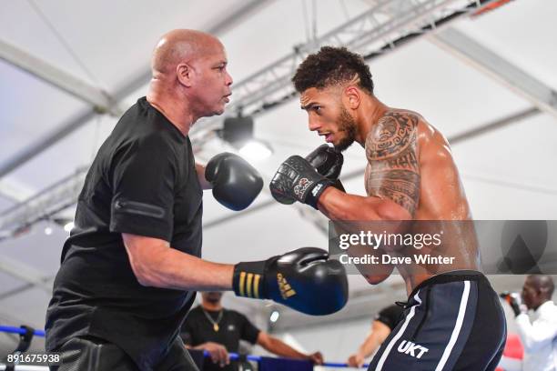 French heavyweight boxer Tony Yoka and his trainer Virgil Hunter at INSEP on December 12, 2017 in Vincennes, France.