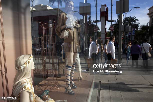 Shoppers pass in front the Chanel SA store on Rodeo Drive in Beverly Hills, California, U.S., on Saturday, Dec. 9, 2017. The U.S. Census Bureau is...