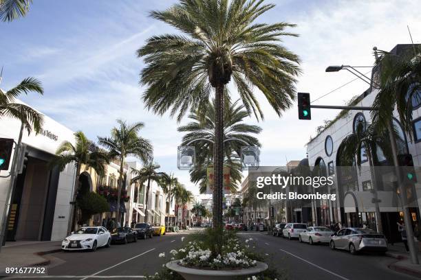 Vehicles sit parked in front of retail stores on Rodeo Drive in Beverly Hills, California, U.S., on Saturday, Dec. 9, 2017. The U.S. Census Bureau is...