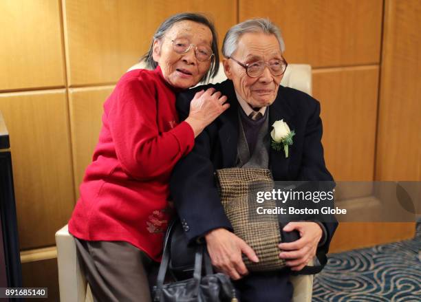 Zhu Dayun and Hui Zong, who have been married for 61 years, share a chair during the annual Boston Elderly Commission Golden Wedding Anniversary...