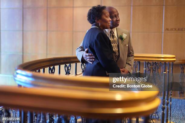 Eugene and Almarita Hendrix, who have been married for 56 years, pose for a photo near the stair railing during the annual Boston Elderly Commission...