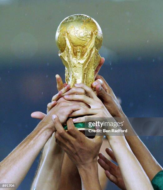 Brazil get their hands on the trophy after the Germany v Brazil, World Cup Final match played at the International Stadium Yokohama in Yokohama,...