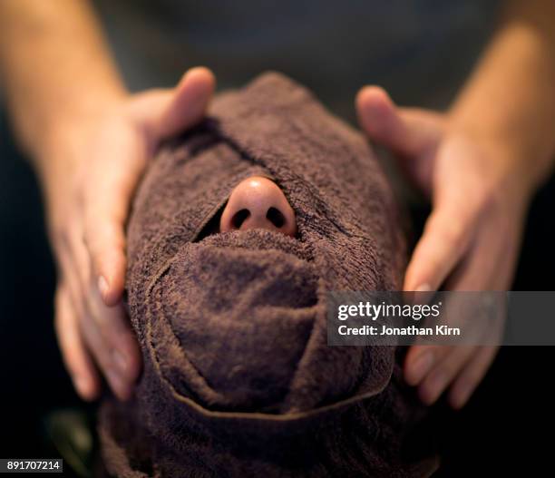 hot towel wrap on a man. - covering nose stock pictures, royalty-free photos & images