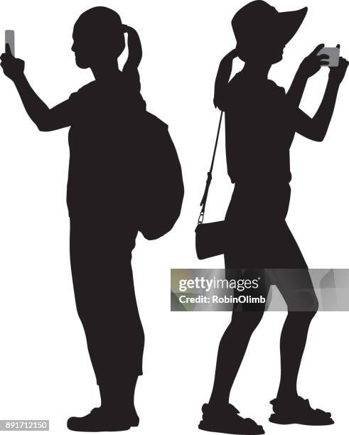 ilustrações de stock, clip art, desenhos animados e ícones de two women taking photos silhouettes - camera stand