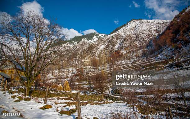 View of snow clad mountains after seasons first snowfall on December 13, 2017 In the outskirts of Srinagar, the summer capital of Indian administered...