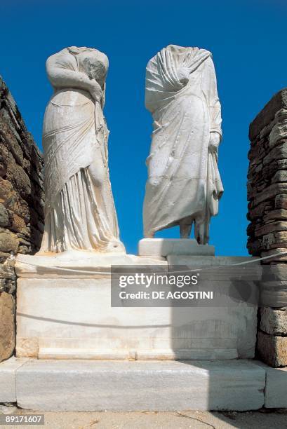 Low angle view of two headless statue, House Of Cleopatra, Cyclades Islands, Southern Aegean, Greece