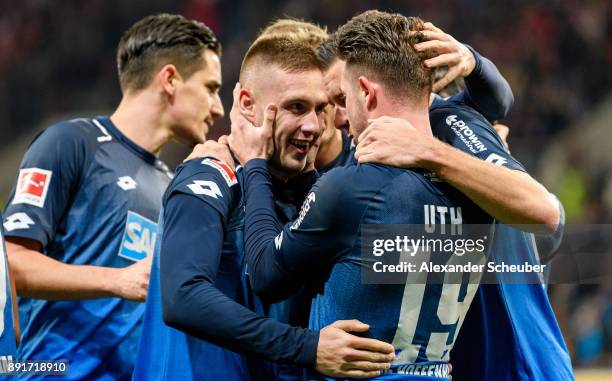Mark-Alexander Uth of Hoffenheim celebrates the first goal for his team with his teammates during the Bundesliga match between TSG 1899 Hoffenheim...