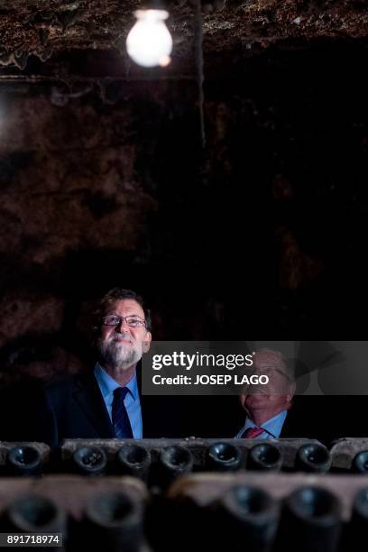 Spanish Prime Minister Mariano Rajoy and Freixenet president Jose Luis Bonet visit the wine cellars of the Freixenet winery in Barcelona on December...