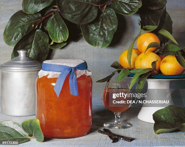 Close-up of a jar of persimmon and orange marmalade