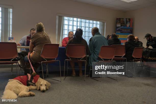 Puerto Ricans meet with Human Services officials at the Osceola County Hurricane Maria Reception Center in Kissimmee, Florida, U.S., on Tuesday, Dec....