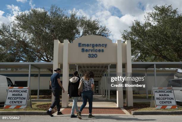 Puerto Ricans arrive at the Osceola County Hurricane Maria Reception Center in Kissimmee, Florida, U.S., on Tuesday, Dec. 12, 2017. After Hurricane...