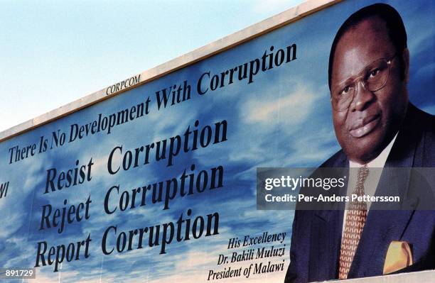 Billboard of Bakili Muluzi, the President of Malawi, displays a message of anti-corruption June 13, 2002 in Lilongwe, Malawi. President Muluzi is...