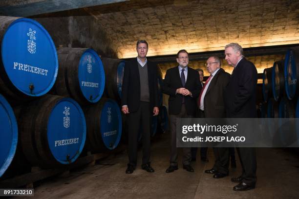 Spanish Prime Minister Mariano Rajoy , Freixenet president Jose Luis Bonet and Catalonia's PP leader and candidate for the upcoming December 21...