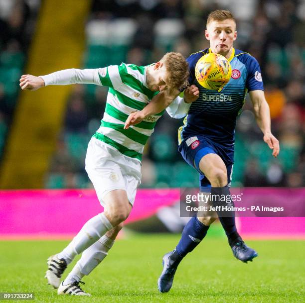 Hamilton's Greg Docherty and Celtic's Stuart Armstrong battle for the ball during the Ladbrokes Scottish Premiership match at Celtic Park, Glasgow.