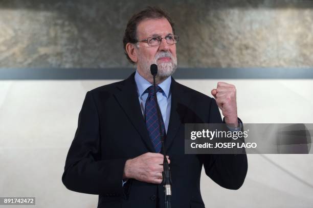 Spanish Prime Minister Mariano Rajoy delivers a speech during a visit to the Freixenet winery in Barcelona on December 13, 2017. / AFP PHOTO / Josep...