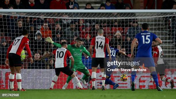 Shinji Okazaki of Leicester City scores his sides second goal past Fraser Forster of Southampton during the Premier League match between Southampton...