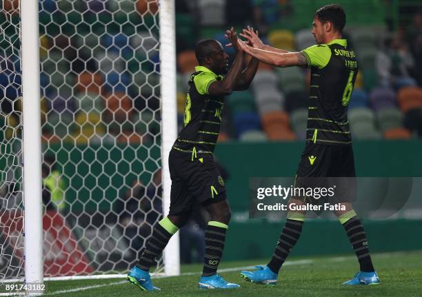 Sporting CP forward Seydou Doumbia from Ivory Coast celebrates with teammate Sporting CP defender Andre Pinto from Portugal after scoring a goal...