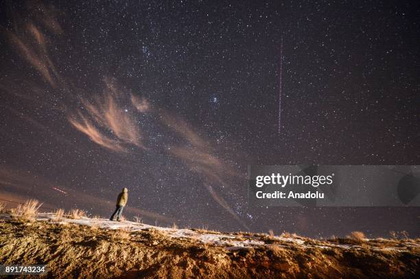 Man looks at the sky during the Geminid meteor shower in Van, eastern Turkey on December 13, 2017.