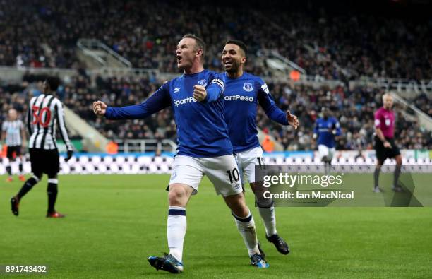 Wayne Rooney of Everton celebrates after scoring his sides first goal with Aaron Lennon of Everton during the Premier League match between Newcastle...