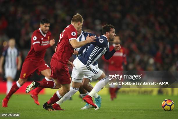 Hal Robson-Kanu of West Bromwich Albion competes with Ragnar Klavan of Liverpool during the Premier League match between Liverpool and West Bromwich...