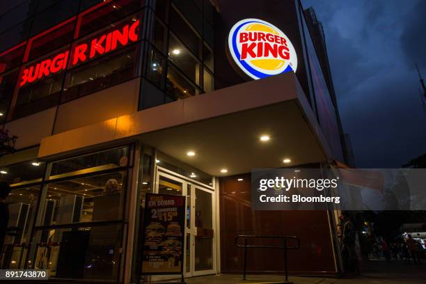 Burger King do Brasil signage stands illuminated at night outside a restaurant on Paulista Avenue in Sao Paulo, Brazil, on Monday, Dec. 11, 2017....