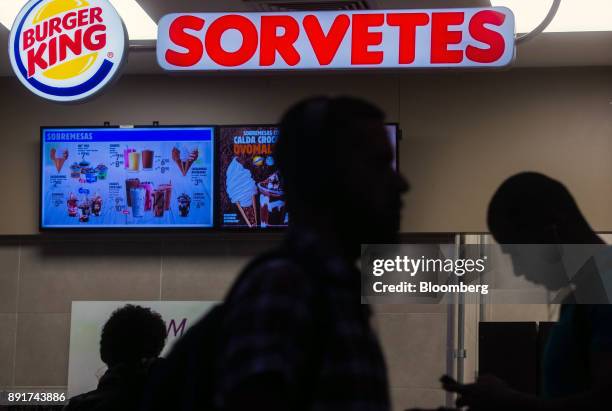 Pedestrians pass in front of a Burger King do Brasil restaurant on Paulista Avenue in Sao Paulo, Brazil, on Monday, Dec. 11, 2017. Burger King do...