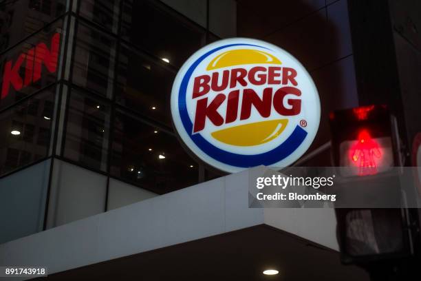 Signage is seen illuminated at night outside of a Burger King do Brasil restaurant on Paulista Avenue in Sao Paulo, Brazil, on Monday, Dec. 11, 2017....