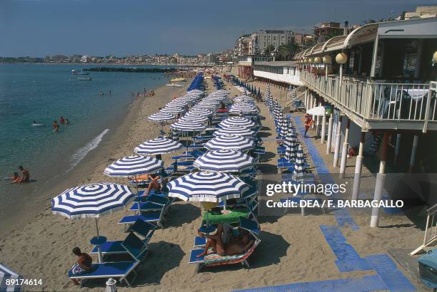 Beach chairs and beach umbrellas on the beach, Giardini-Naxos, Sicily, Italy