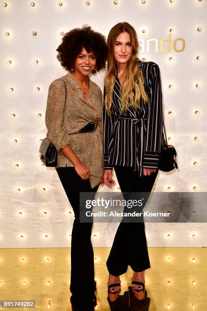 Aminata Belli and Hannah Liza attend the Zalando xmas bash hosted by Alek Wek at Haus Ungarn on December 13, 2017 in Berlin, Germany.