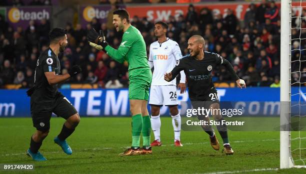 David Silva of Manchester City celebrates after scoring his sides first goal during the Premier League match between Swansea City and Manchester City...