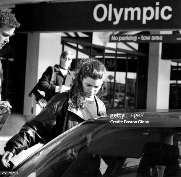 Figure skater Nancy Kerrigan leaves Logan Airport in Boston upon her arrival from Detroit on Jan. 10, 1994. Kerrigan suffered a knee injury in...