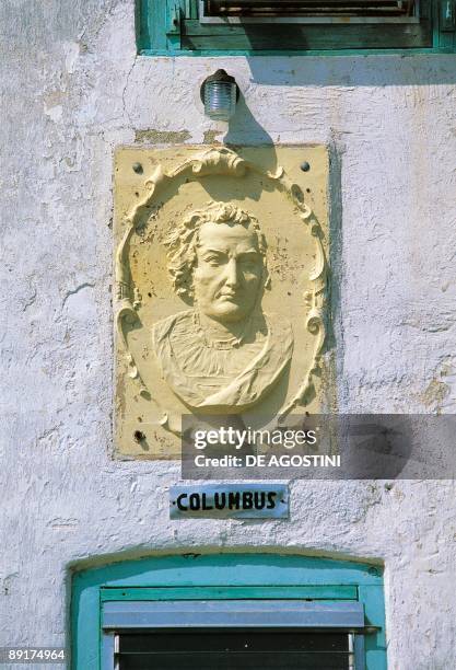 Close-up of a statue of Christopher Columbus carved on the wall of a church, San Salvador Island, Cockburn, Bahamas