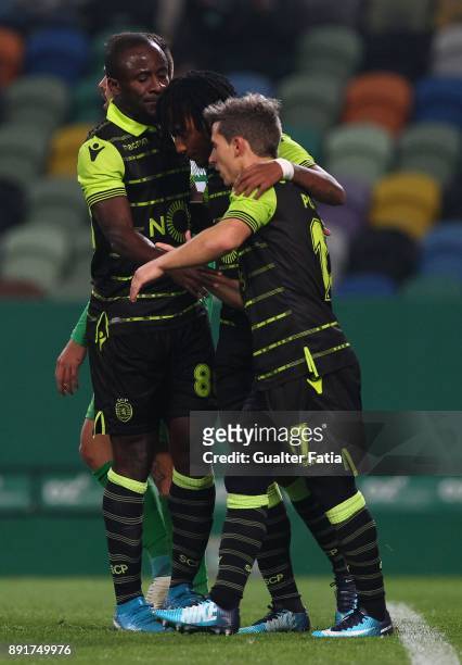 Sporting CP forward Seydou Doumbia from Ivory Coast celebrates with teammates after scoring a goal during the Portuguese Cup match between Sporting...
