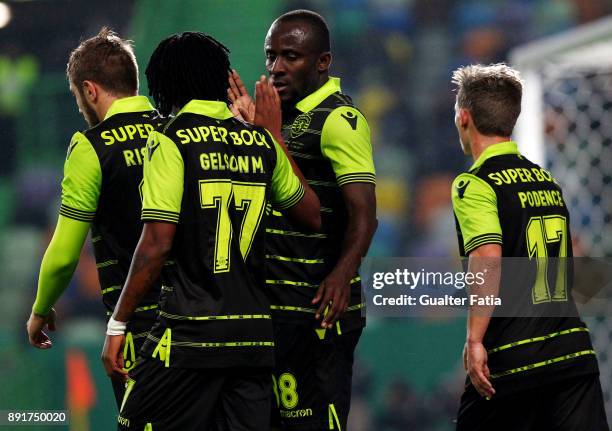 Sporting CP forward Seydou Doumbia from Ivory Coast celebrates with teammates after scoring a goal during the Portuguese Cup match between Sporting...