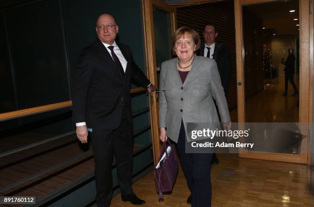 German Chancellor Angela Merkel leaves a meeting in the Bundestag with leaders of the SPD, CSU and her own party on December 13, 2017 in Berlin,...
