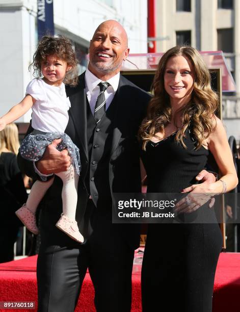 Dwayne Johnson, Lauren Hashian and daughter Jasmine Johnson attend a ceremony honoring him with a star on The Hollywood Walk of Fame on December 13,...
