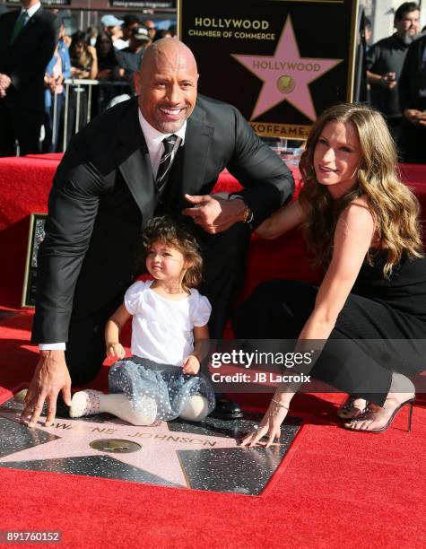 Dwayne Johnson, Lauren Hashian and daughter Jasmine Johnson attend a ceremony honoring him with a star on The Hollywood Walk of Fame on December 13,...