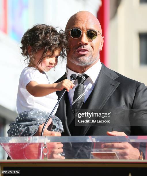 Dwayne Johnson and daughter Jasmine Johnson attends a ceremony honoring him with a star on The Hollywood Walk of Fame on December 13, 2017 in Los...