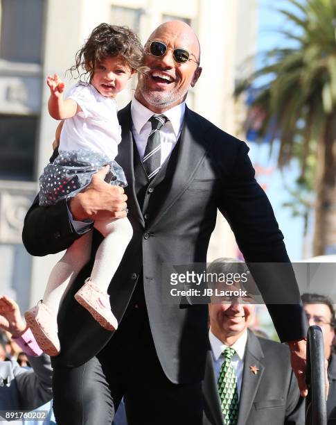 Dwayne Johnson and daughter Jasmine Johnson attends a ceremony honoring him with a star on The Hollywood Walk of Fame on December 13, 2017 in Los...