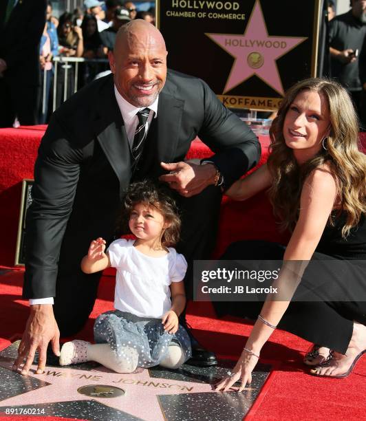 Dwayne Johnson, Lauren Hashian and daughter Jasmine Johnson attend a ceremony honoring him with a star on The Hollywood Walk of Fame on December 13,...