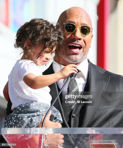 Dwayne Johnson and daughter Jasmine Johnson attends a ceremony honoring him with a star on The Hollywood Walk of Fame on December 13, 2017 in Los...