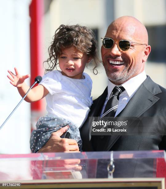 Dwayne Johnson and daughter Jasmine Johnson attends a ceremony honoring him with a star on The Hollywood Walk of Fame on December 13, 2017 in Los...