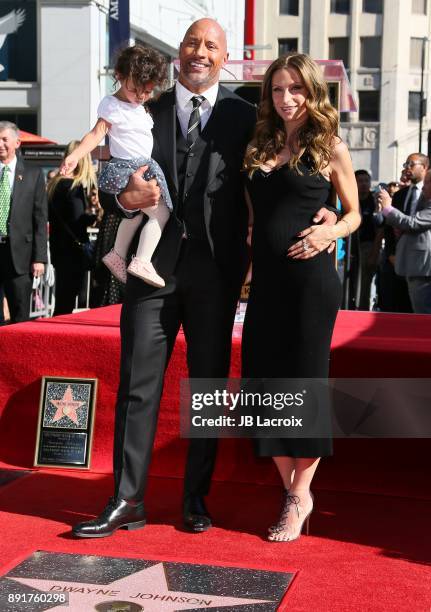 Dwayne Johnson, Lauren Hashian and daughter Jasmine Johnson attend a ceremony honoring him with a star on The Hollywood Walk of Fame on December 13,...
