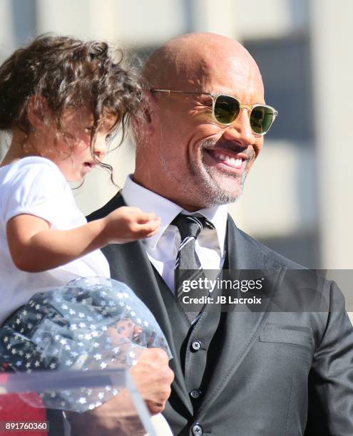 Dwayne Johnson and daughter Jasmine Johnson attends a ceremony honoring him with a star on The Hollywood Walk of Fame on December 13, 2017 in Los...