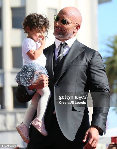 Dwayne Johnson and daughter Jasmine Johnson attends a ceremony honoring him with a star on The Hollywood Walk of Fame on December 13, 2017 in Los...