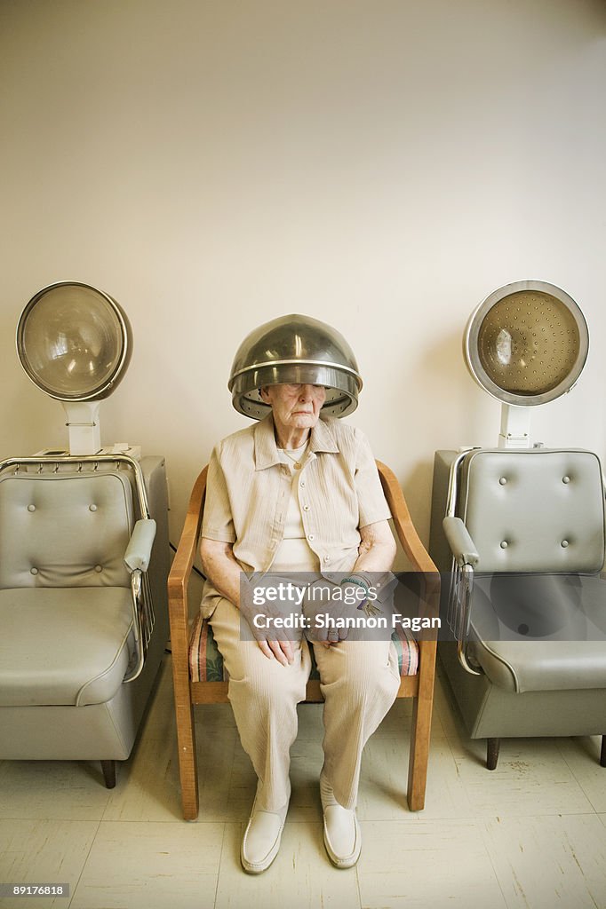 Elderly Woman At Salon With Rollers in Hair