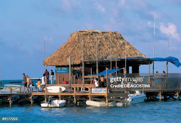 Tourists on a stilt house in the sea, San Pedro, Ambergris Caye, Belize