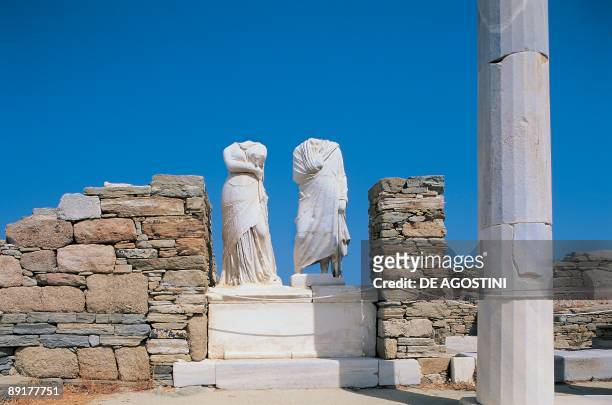 Low angle view of two headless statue, House Of Cleopatra, Cyclades Islands, Southern Aegean, Greece