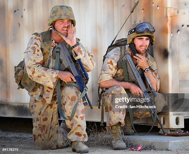 Australian soldiers who are role playing as an enemy soldiers yell instructionsas they came under attack from U.S Marines from the 31st Marine...